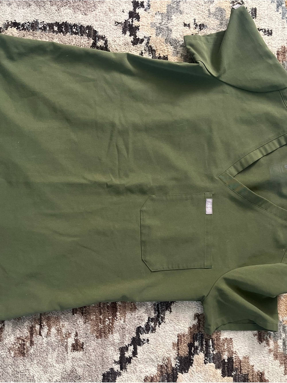 Figs woman army green scrub top.